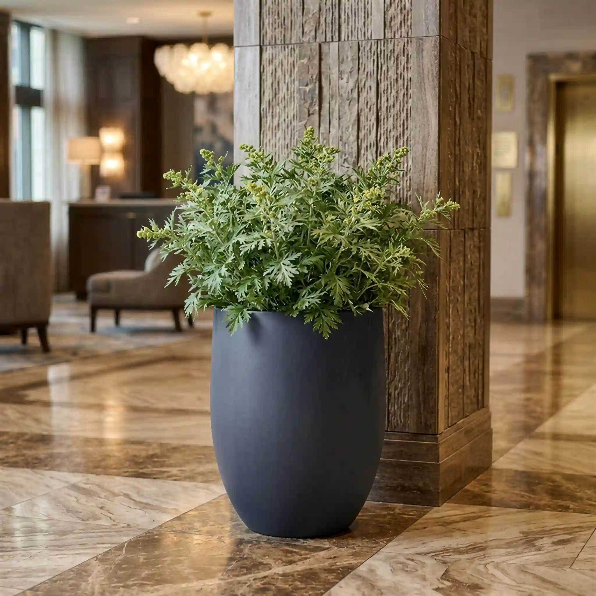 Charcoal RC-1016 large indoor planter placed in a hotel-style lobby